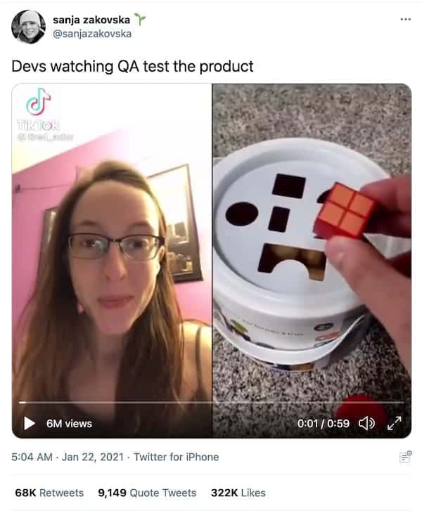 screenshot of a tweet from @sanjazakovska that says "Devs watching QA test the product" with a video of a woman watching someone play with a block and bucket toy