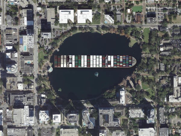 a picture of the Ever Given freighter positioned in Lake Eola in downtown Orlando