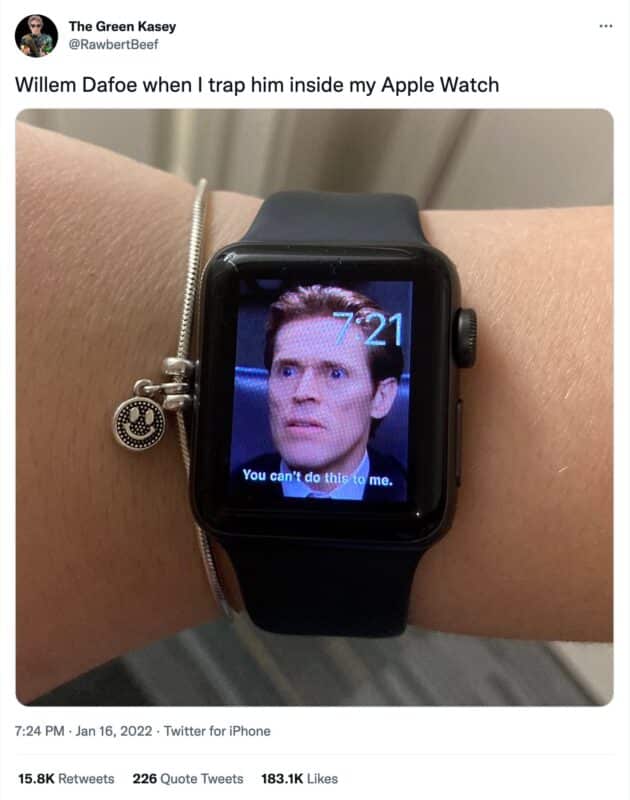 a tweet from @RawbertBeef that reads, "Willem Dafoe when I trap him inside my Apple Watch". The attached image is an arm wearing a bracelet and an apple watch, and the watch has a background image of Willem Dafoe's face looking shocked and the text "You can't do this to me."